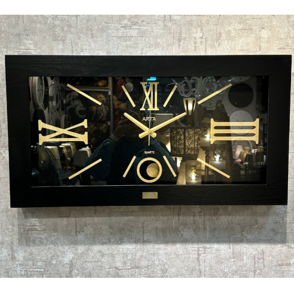  ساعت دیواری آرتا Arta کد 420، ساعت دیواری چهارگوش چوبی سایز 83x43 سانت، با متریال MDF، رنگ مشکی، دارای موتور آرامگرد، ساعت دیواری با اعداد رومی