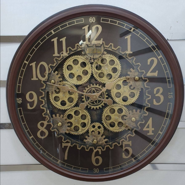 ساعت دیواری اویسا مدل 403، ساعت دیواری ساخته شده با بدنه پلاستیک، دارای چرخ دنده متحرک روی صفحه ساعت، اعداد لاتین، رنگ قهوه ای، سایز 68