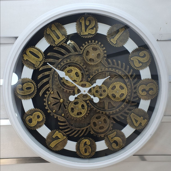ساعت دیواری اویسا مدل 406، ساعت دیواری ساخته شده با بدنه پلاستیک، دارای چرخ دنده متحرک روی صفحه ساعت، اعداد لاتین، سایز 70، رنگ سفید