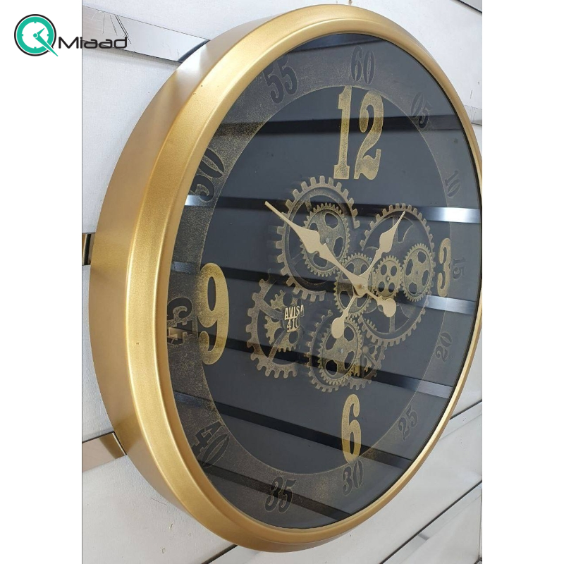 ساعت دیواری اویسا مدل 410، ساعت دیواری ساخته شده با بدنه پلاستیک، دارای چرخ دنده متحرک روی صفحه ساعت، اعداد لاتین، سایز 60، رنگ طلایی