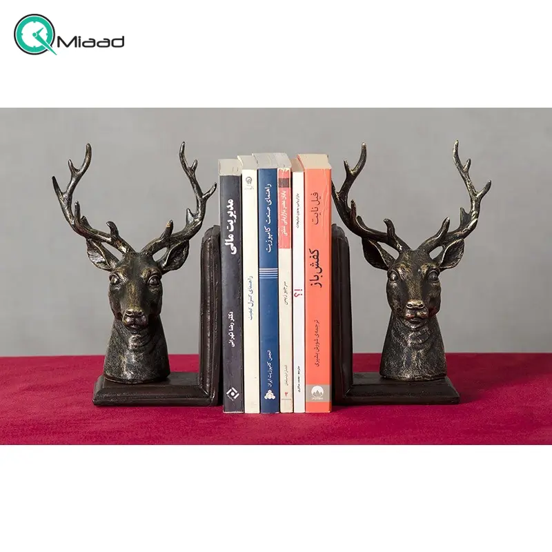 هولدر کتاب طرح گوزن مدل MO16118، مجسمه دکوری و زیبا با کارایی هولدر کتاب، زیبا کننده هر میز و هر سطحی، هدیه ای مناسب برای خانم ها و حتی آقایان کتابخوان، رنگ مشکی طلایی مجسمه