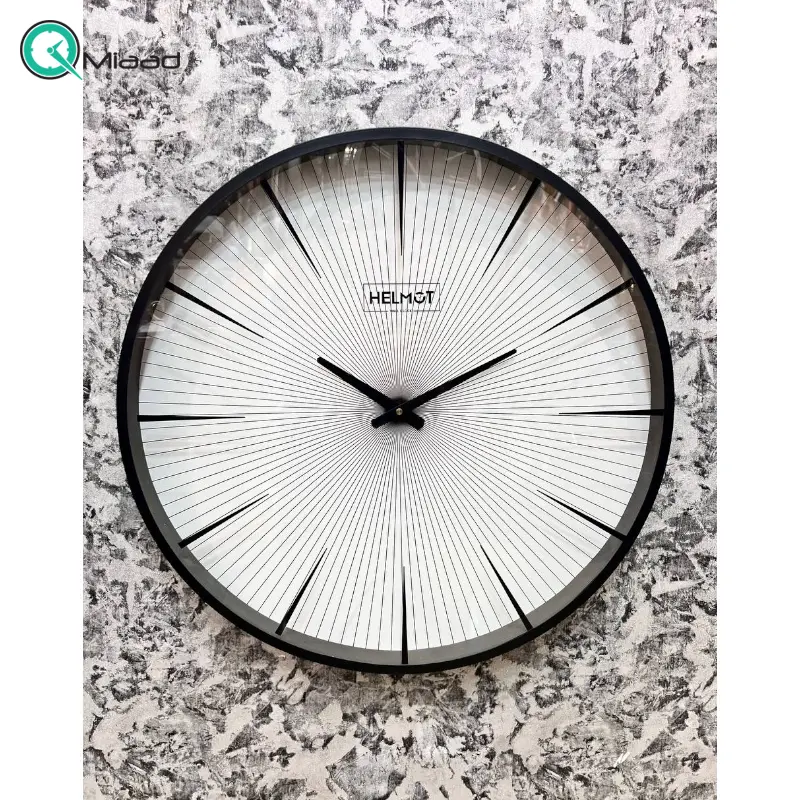 ساعت دیواری هلموت کد 6076، ساعت دیواری مدرن با طراحی مینیمال و بدنه از جنس فلز رنگ استاتیک، سایز 60 سانتی متر، موتور میتسو با 5 سال ضمانت هلموت ساعت