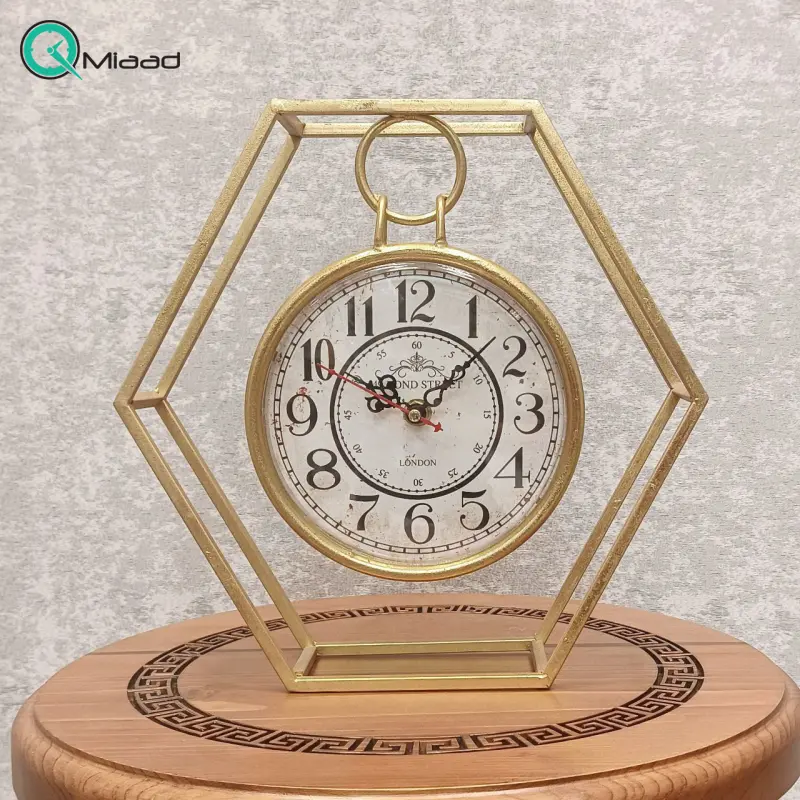 ساعت رومیزی فلزی شش ضلعی، ساعت رومیزی جدید با طراحی خلاقانه و طرح شش ضلعی، اعداد لاتین، از جنس فلز با موتور آرامگرد مناسب میز کار و میز کنسول ساعت رومیزی
