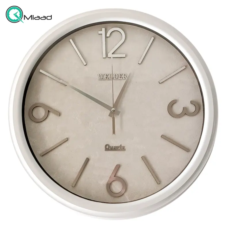 ساعت دیواری ولدر Welder مدل 100، ساعت دیواری سایز 35 با عقرب های متفاوت، دارای رنگ بندی، شماره برجسته مولتی با فونت لاتین، دارای موتور درجه یک میتسو، رنگ سفید ساعت دیواری