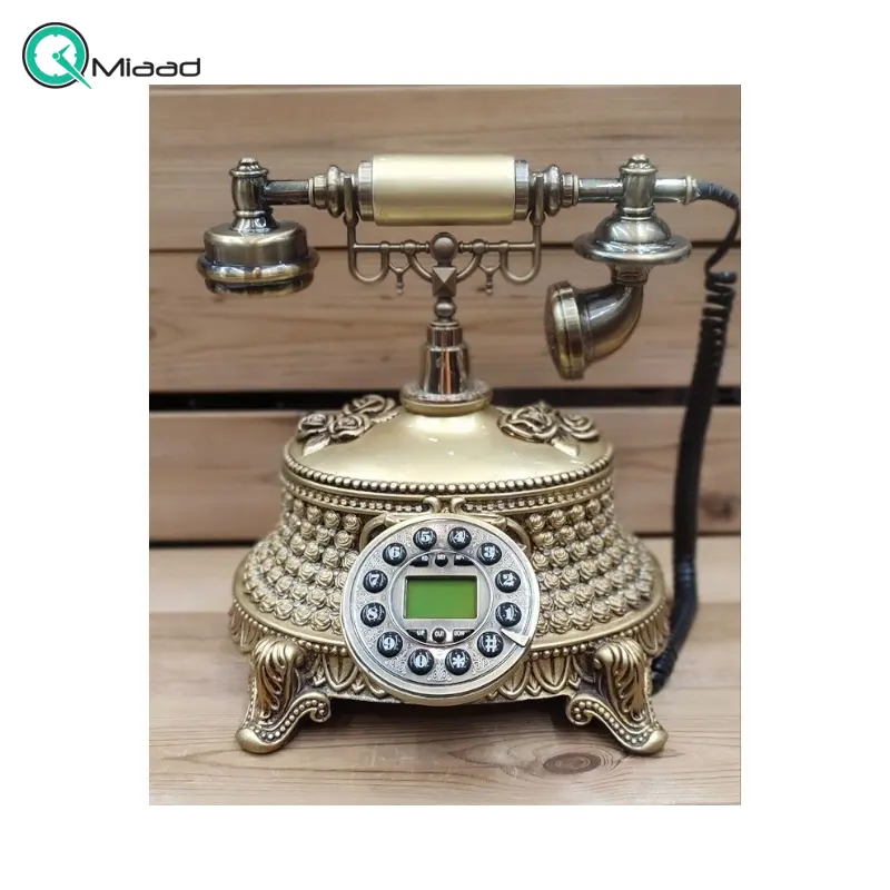 تلفن سلطنتی رومیزی رایکا مدل 320، تلفن سلطنتی با طراحی طرح نقش برجسته روی بدنه تلفن، شماره گیر دکمه ای و دارای کالر آیدی، دکوری شیک و جذاب مناسب منزل و محل کار| رنگ طلایی تلفن رومیزی