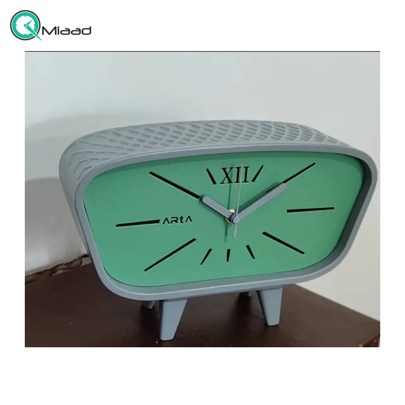 ساعت رومیزی بِتُنی مستطیل مدل 1060، ساعت رومیزی اسپرت مستطیل با متریال بتن، دارای رنگ بندی ویژه، طراحی فانتزی و مینیمال، موتور آرامگرد و 2 سال ضمانت، رنگ خاکستری سبز ساعت رومیزی