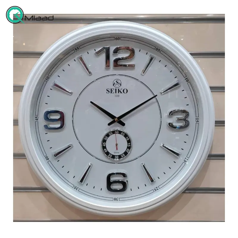 ساعت دیواری سیکو مدل AS110، ساعت دیواری دو زمانه با تنوع رنگی، دارای موتور روانگرد و اعداد برجسته آبکاری شده لاتین، سایز 65، رنگ سفید نقره ای ساعت سیکو
