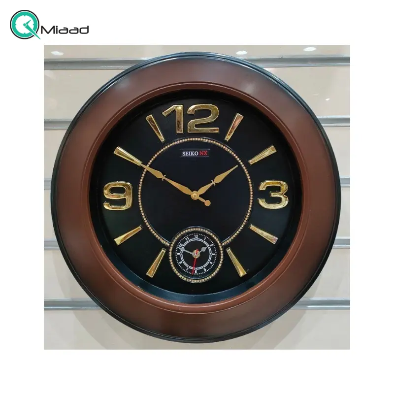 ساعت دیواری سیکو مدل NX، ساعت دیواری دو زمانه با تنوع رنگی، دارای موتور روانگرد و اعداد برجسته آبکاری شده لاتین، سایز 50، رنگ مشکی طلایی ساعت سیکو