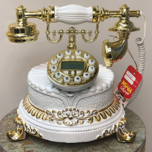 تلفن رومیزی سلطنتی میرون مدل 144، تلفن رومیزی سلطنتی دارای شناسه تماس گیرنده و شماره گیر دکمه ای، رنگ سفید طلایی	