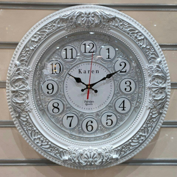 ساعت دیواری پرشین کارن، ساعت دیواری با طراحی برجسته و حکاکی روی صفحه و بدنه ساعت، دایره ای شکل، اعداد لاتین، سایز 50، رنگ سفید