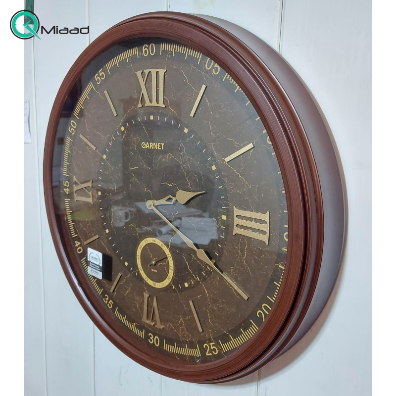 ساعت دیواری شوبرت مدل 5268 گارنت، ساعت دیواری سایز 60 طرح چوبی فریم پلاستیکی با قیمت اقتصادی، دارای موتور ثانیه شمار مستقل، رنگ قهوه ای ساعت دیواری چوبی