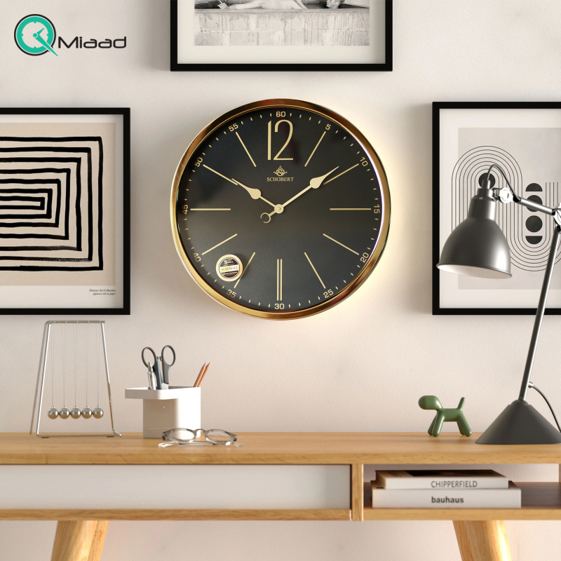 ساعت دیواری فلزی شوبرت مدل 5304، ساعت دیواری مدرن و فلزی جدید شوبرت، دارای طراحی ظریف و زیبا، سایز 50،موتور آرامگرد، رنگ طلایی صفحه مشکی ساعت دیواری فلزی