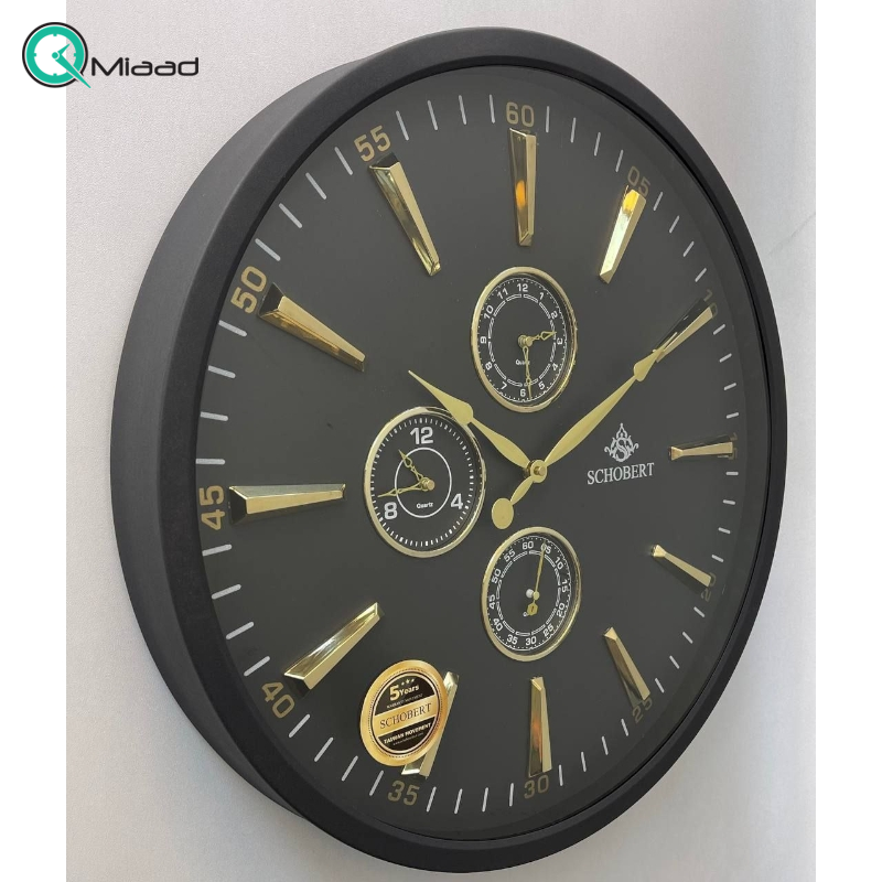 ساعت دیواری فلزی شوبرت مدل 5310، ساعت دیواری مدرن و فلزی با طراحی عالی، دارای چهار موتور فعال ، دارای موتور نمایش گرافیکی روز و شب، رنگ مشکی طلایی ساعت دیواری فلزی