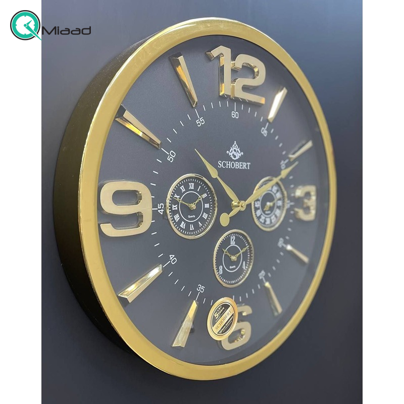 ساعت دیواری فلزی شوبرت مدل 5311، ساعت دیواری چهار موتوره سایز 50 با اعداد و عقربه های طلایی، رنگ طوسی طلایی ساعت دیواری فلزی