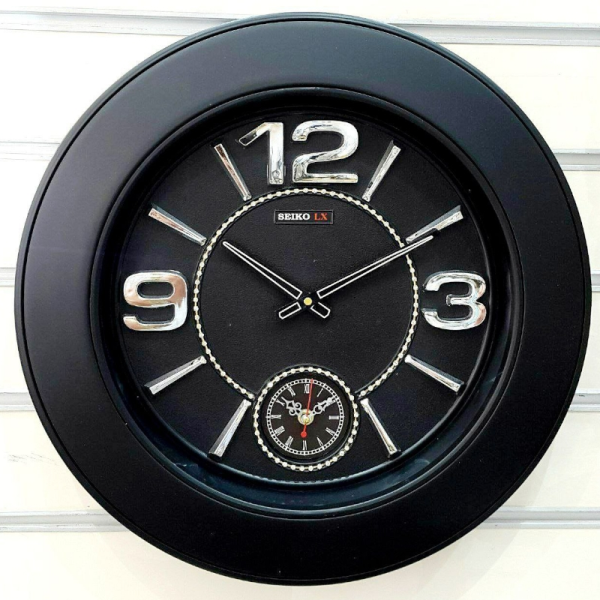 ساعت دیواری سیکو LX، ساعت دیواری دو زمانه با تنوع رنگی، دارای موتور روانگرد، سایز 50، رنگ مشکی نقره ای