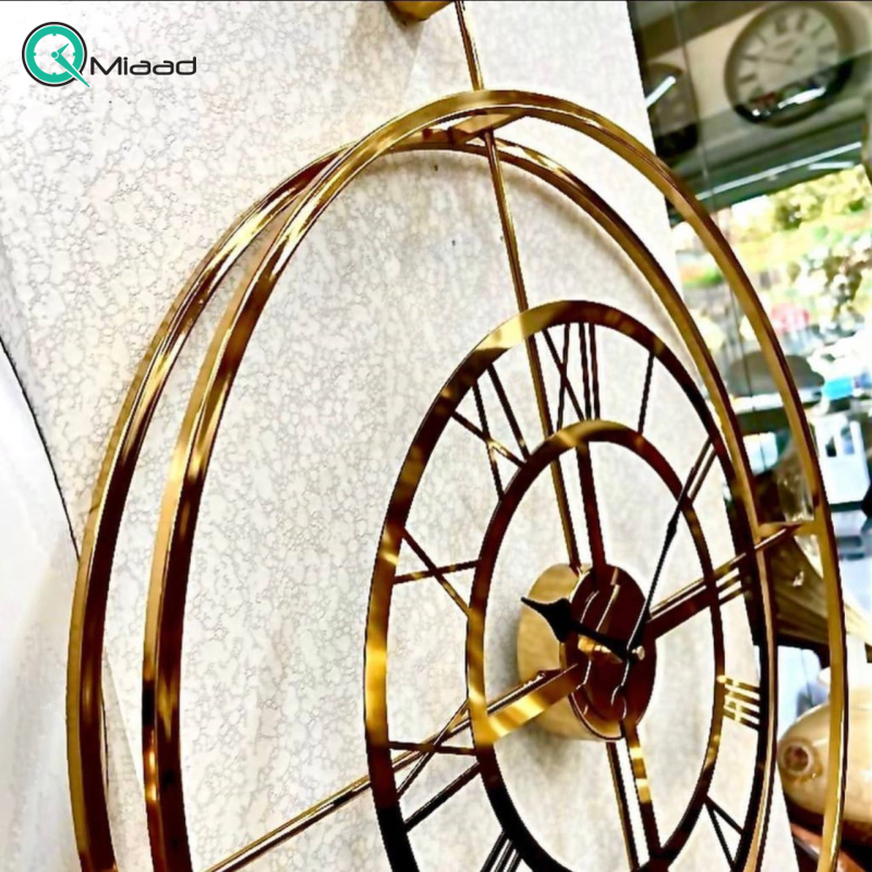 ساعت دیواری تسو مدل 1005، ساعت دیواری مدرن و ساده فلزی قطر 70 سانت با موتور آرامگرد، رنگ طلایی با آبکاری فورتیک قیمت ساعت دیواری