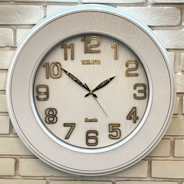 ساعت دیواری ولدر Welder مدل 310، ساعت دیواری سایز 55 شماره برجسته،متریال ترکیبی چوب و پلاستیک، دارای فونت لاتین اعداد، دارای موتور آٰرامگرد درجه یک، عقربه های متفاوت، رنگ سفید