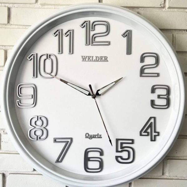ساعت دیواری ولدر Welder، ساعت دیواری سایز 60 شماره برجسته، متریال پلاستیک بدنه، دارای فونت لاتین اعداد، دارای موتور آٰرامگرد درجه یک میتسو، عقربه های متفاوت، رنگ سفید | مدل 630