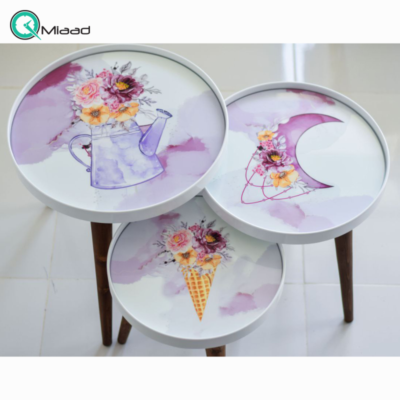 میز عسلی کد M104074، میز عسلی چوبی سه تکه طرح دار، نقاشی شده به سبک روستیک، دارای شیشه متحرک، میز عسلی مدل گرد سری 3 خرید میز عسلی